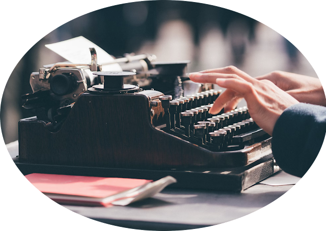 person using black typewriter