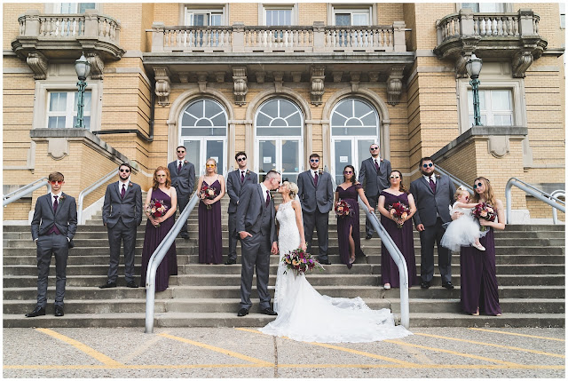 photo of wedding party on steps with sunglasses