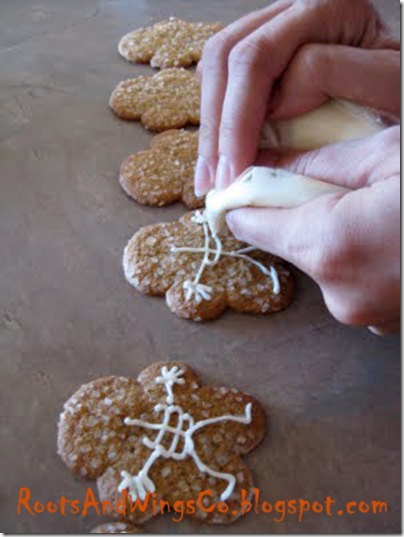 with the frosting in a baggie and the end cut off the baggie ice on your details