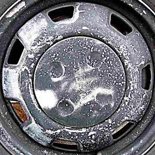 Battered Nissan Hubcap