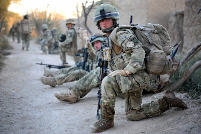 A private from the Royal Army Medical Corps on patrol with A Company of the 1st Batallion of the Royal Irish Regiment near Patrol Base Kalang in Helmand province Afghanistan in 2010