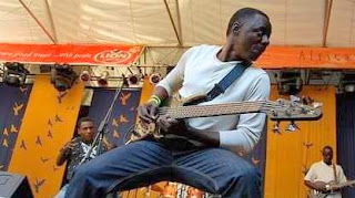 Alick Macheso talking guitar at a live show