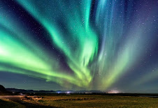 An image of the aurora over the night sky.