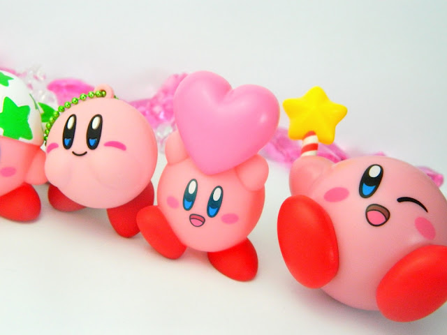 Three Nintendo Kirby figures in a row 