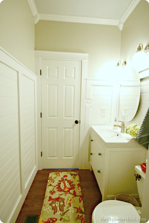 bathroom with planked walls