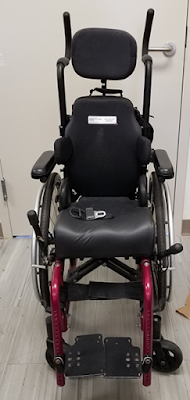 pink pediatric wheelchair photo