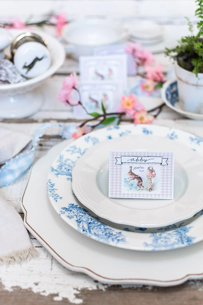Easter rabbit place card on blue white place setting, ribbon, ironstone, chippy paint