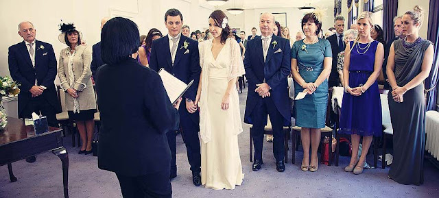 bride groom officiant and both families at Marylebone Town Hall wedding