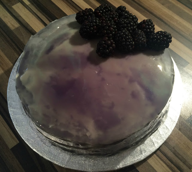 Photograph of my home baked Blackberry Mirror Glaze Cake