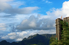 urban buildings against a background of hills