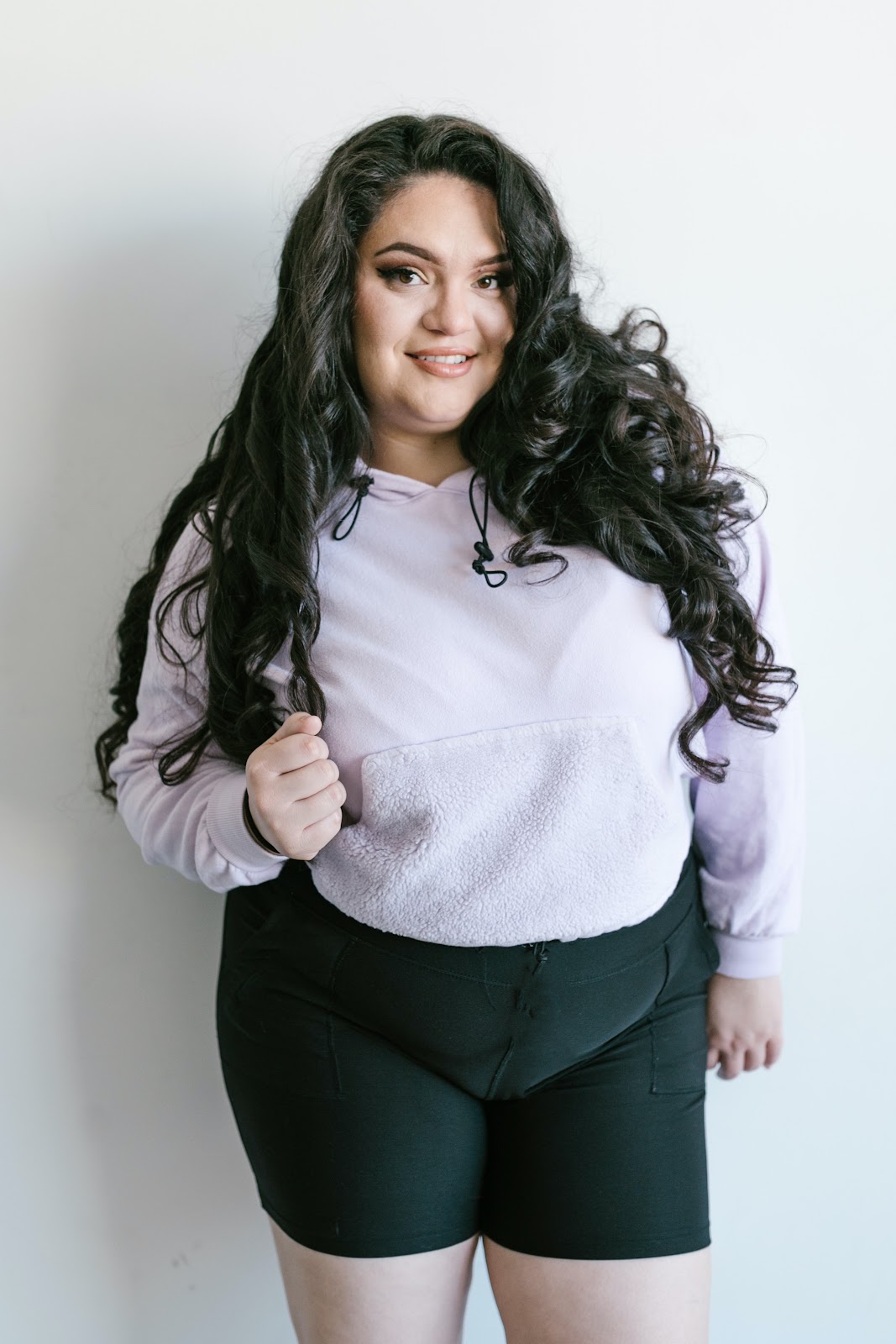 beautiful dark haird, plus sized woman in workout clothes