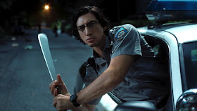 adam driver leans out a car window with a machete