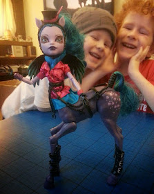 Boys playing with Monster High Freaky Fusion Hybrid Doll Avea Trotter