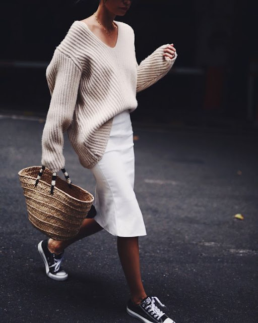  Oversized sweater tucked into pencil skirt, worn with sneakers and a big straw tote