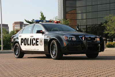 GM equipped Chevrolet Caprise under police car