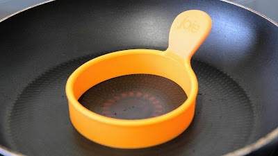 Orange silicone ring in a frying pan