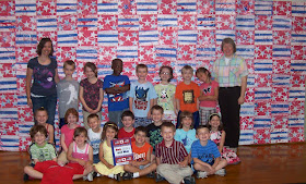 photo of: Monumental Construction Paper Quilt by Carie's Kindergarten Class in Response to "Red, White and Blue" by Debbie Clement