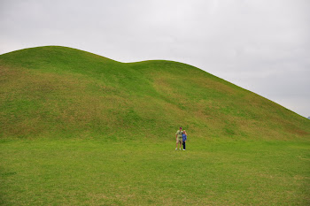Mom and Dad next to the huge Hill Tombs