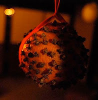 Pomander, orange studded with cloves.