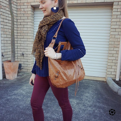 awayfromblue instagram navy blouse with leopard print scarf and burgundy skinny pants outfit