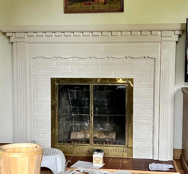 Photo of a fireplace mantel painted with Dixie Belle Drop Cloth Chalk Paint.