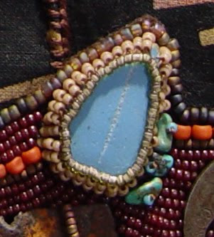 bead embroidery collage by Robin Atkins, bead journal project, detail of bezel holding ceramic shard