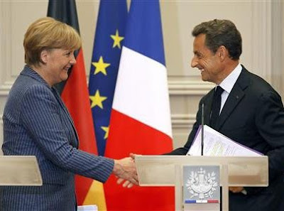 Sarkozy and Merkel push