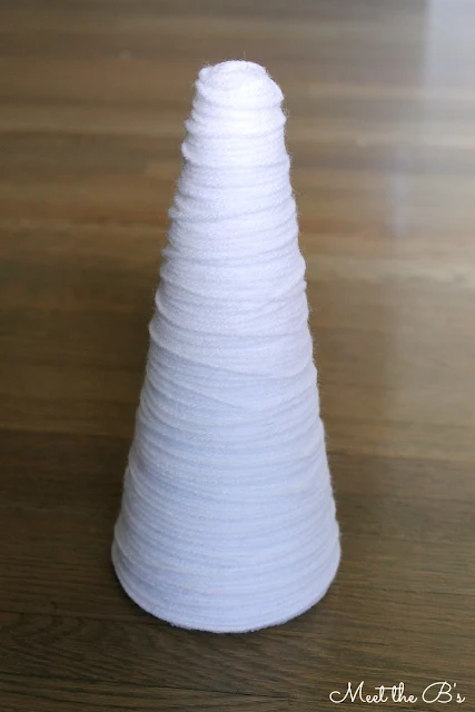 How to make easy DIY Valentine's Day decor made from yarn and styrofoam cones.