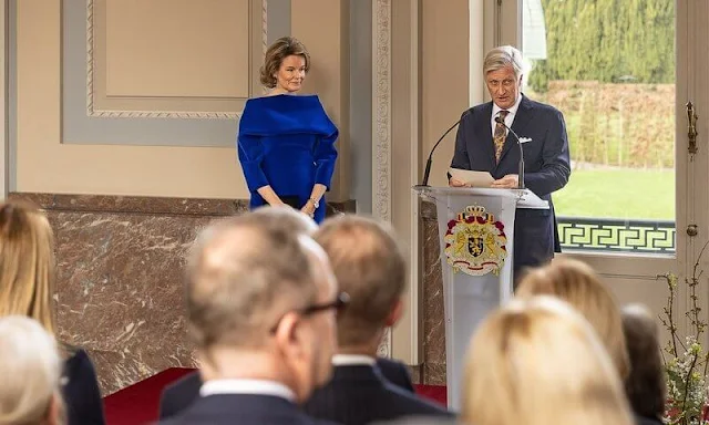 Queen Mathilde wore a royal blue velvet flexible scuba dress by Natan for the European institutions meeting