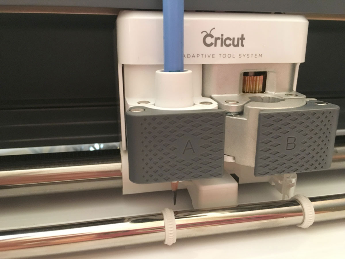 Inserting pencil into cricut make