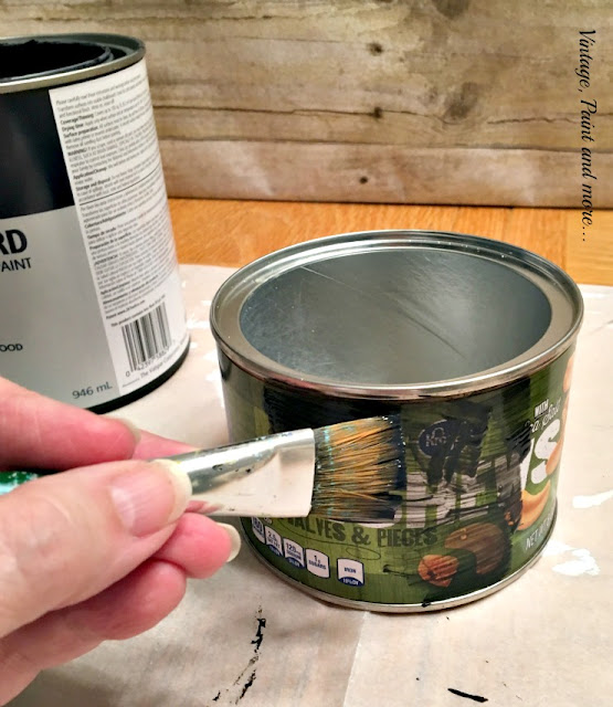 painting a cashew can with black chalkboard paint