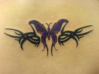 Lovely black tribal and violet butterfly tattoo design.