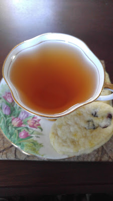 Top Down photo of Antique Garden Tea Cup with Cranberry-Orange Scones from PlumPetite.blogspot.com