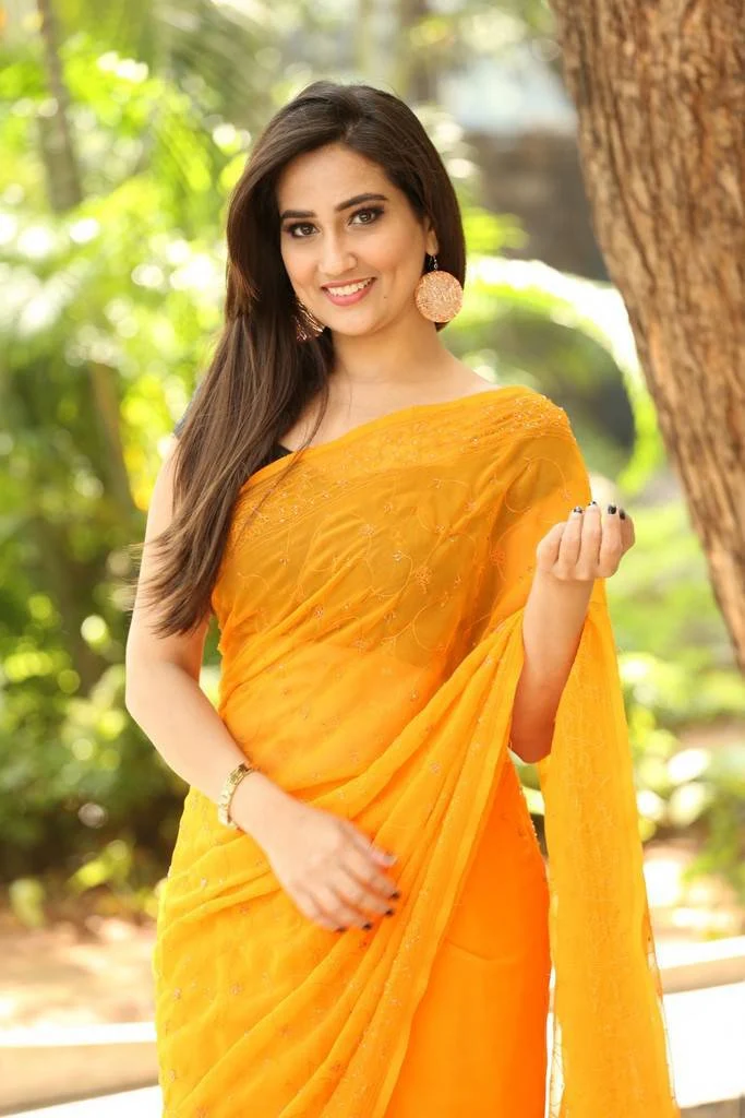 Telugu TV Anchor Manjusha Photoshoot In Transparent Yellow Saree