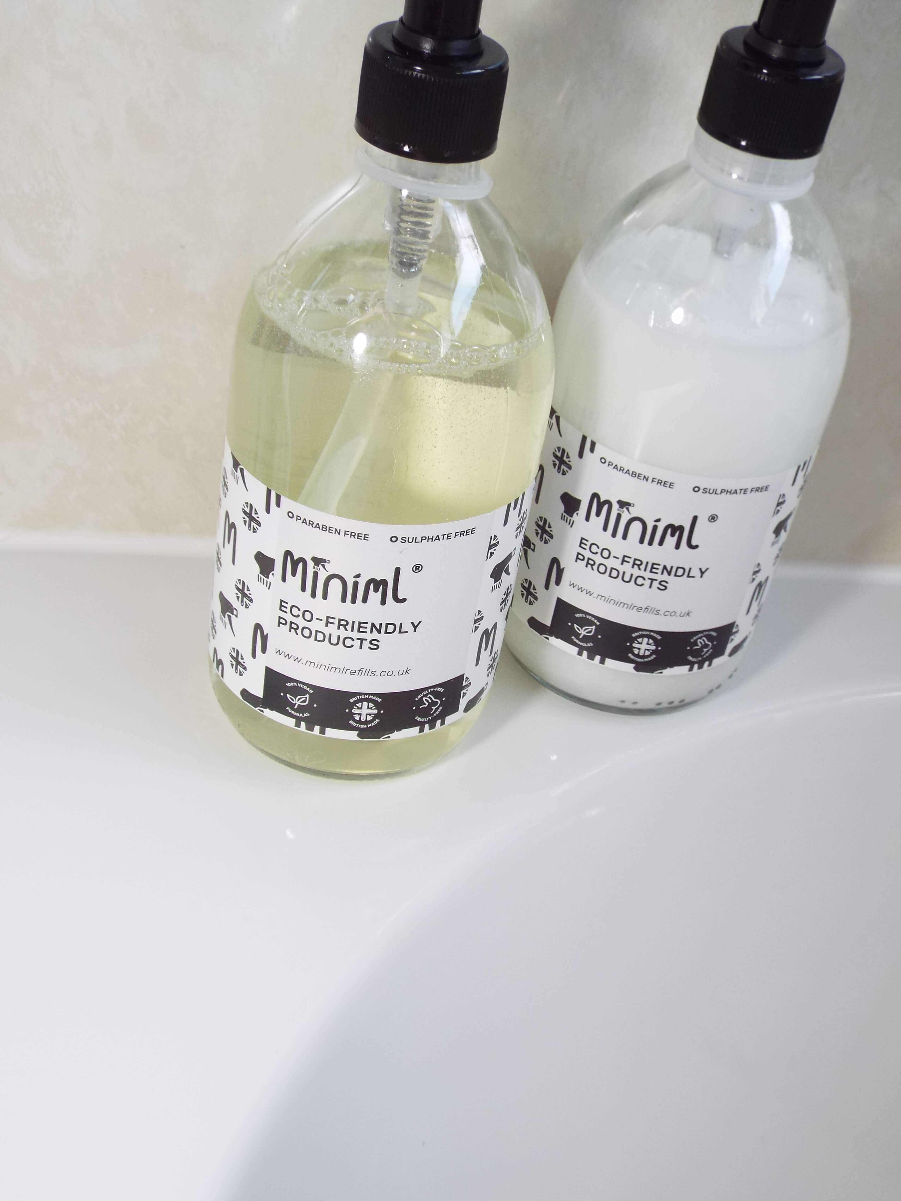 Eco-friendly Minimal refillable Shampoo and conditioners, in glass refillable bottles with pump tops.