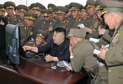 arrested for sitting in a "disrespectful" posture during a meeting led by Kim Jong Un