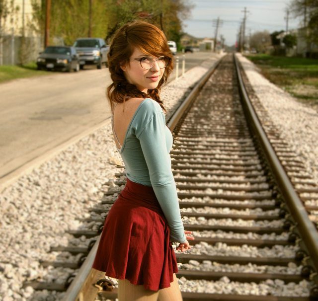 beautiful red head waiting for train