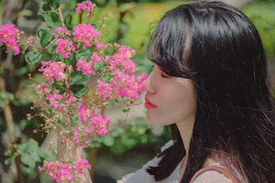 stunning women in nature with flowers