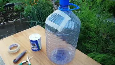 a large plastic water bottle on a table