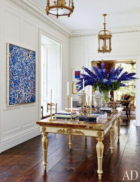 beautiful white and blue formal dining room gold lighting and accents
