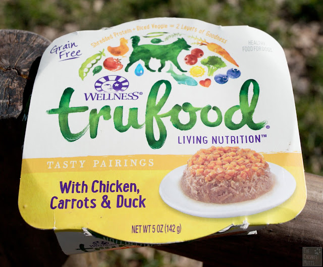 A container of Wellness TruFood Tasty Pairings with Chicken, Carrots & Duck dog food
