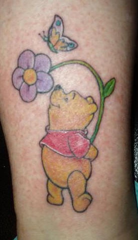 Winnie the pooh with flower and butterfly