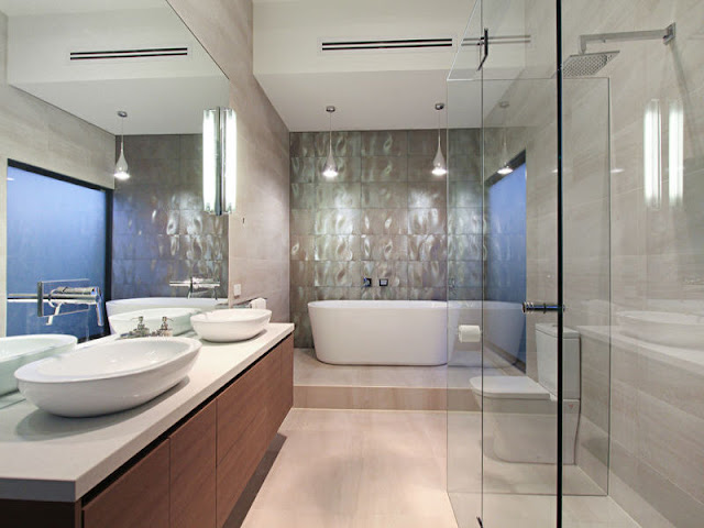 Picture of modern bathroom with two sinks, white bathtub and glassy shower cabin