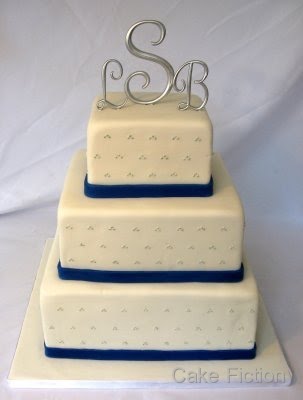 A three tier square wedding cake designed to match the bride 39s blue white
