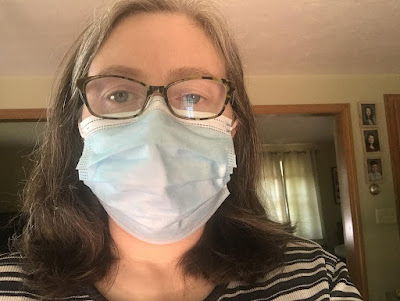 Exile #2's selfie wearing a blue surgical mask