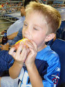 He was watching the game on the jumbo tron.thats my boy! Yum hotdogs!