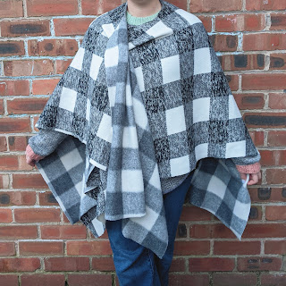 no sew shawl in black and white check worn draped and crossed over slightly at the front