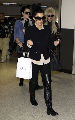 Kim and Khloe Kardashian Arriving on a flight at LAX Airport Pics