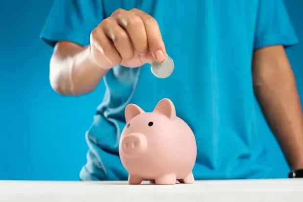 Entrepreneur setting financial goals with a calculator, charts, and a financial planner.
