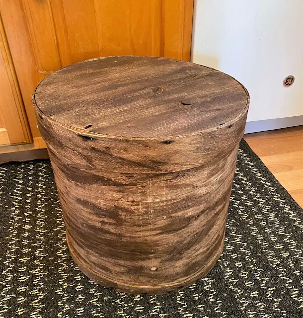 Photo of a large round wooden box with lid from the consignment shop.